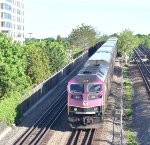 MBTA Train # 2071 finishes crossing the Neponset River Bridge and enters the City of Quincy with HSP-46 # 2032 pulling a set of Bilevel Cars. The T Red Line Subway trackage is on the right. I took this picture from the Quincy Shore Dr bridge on 5/25/24.